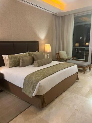a bedroom with a large bed in a room at 2 Bedroom Luxury Condo in Nuevo Vallarta 