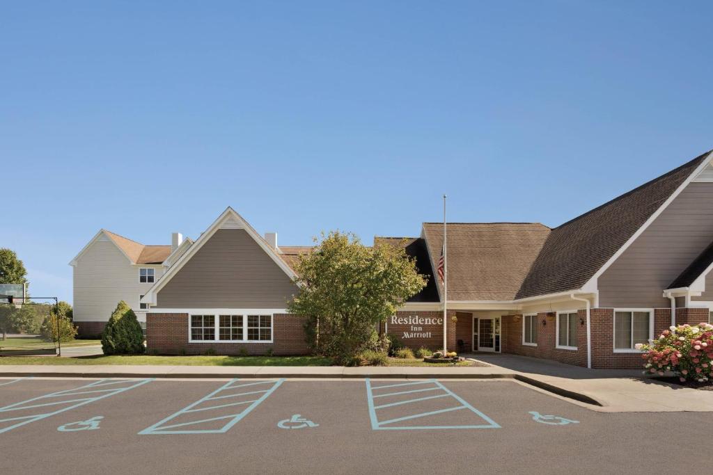 a view of the front of a school with a parking lot at Residence Inn by Marriott Scranton in Scranton