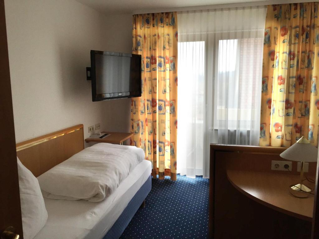 Postel nebo postele na pokoji v ubytování Hotel Gasthof Herderich