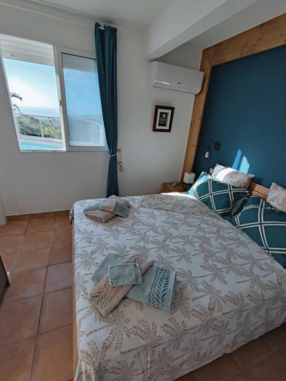 Postel nebo postele na pokoji v ubytování Bel appartement avec piscine privée et vue exceptionnelle