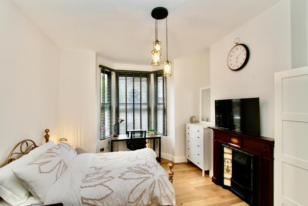 Ένα ή περισσότερα κρεβάτια σε δωμάτιο στο Amazing Studio Apartment East London
