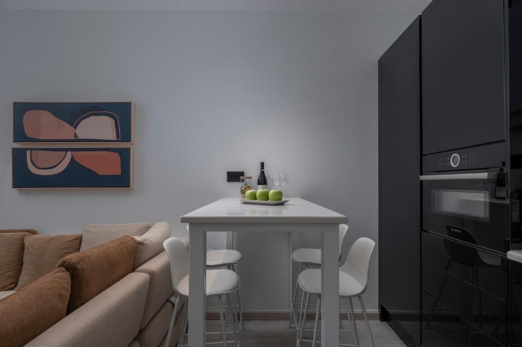 a living room with a couch and a table at Embassy Elegant Suite in Thessaloniki