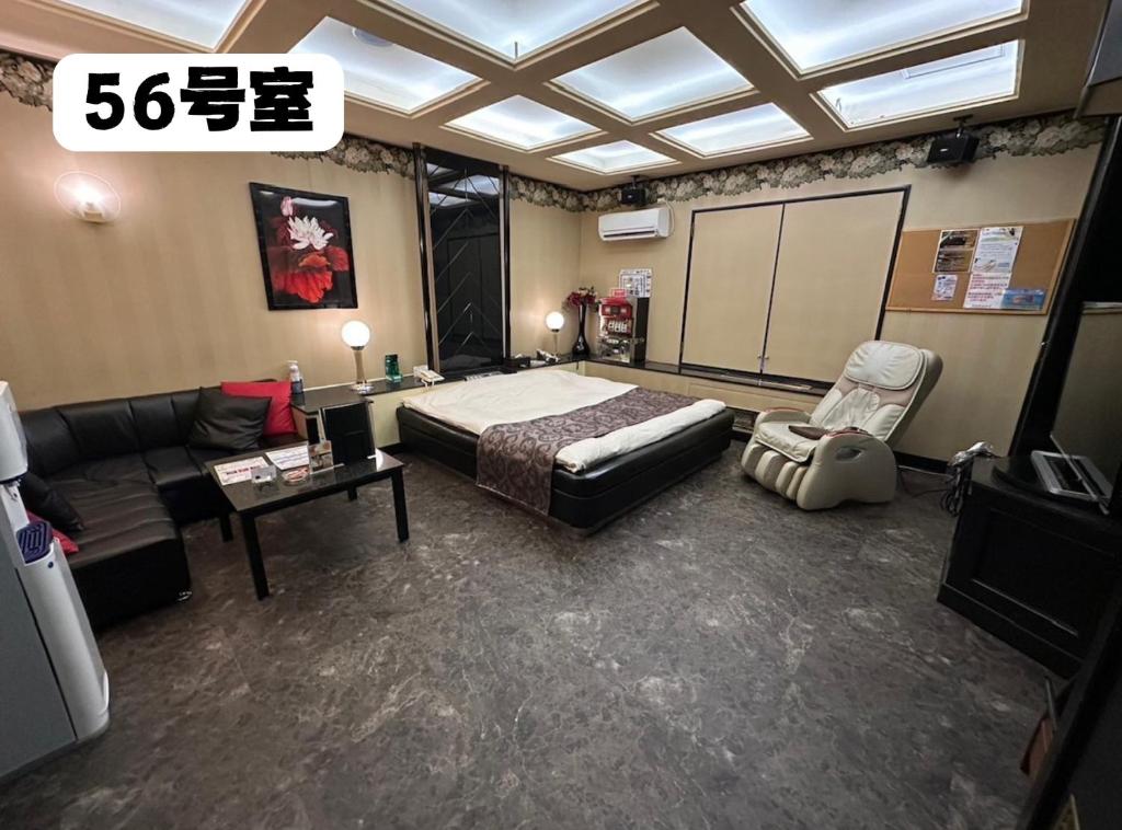 Postel nebo postele na pokoji v ubytování 大人専用ホテルイエスタディ