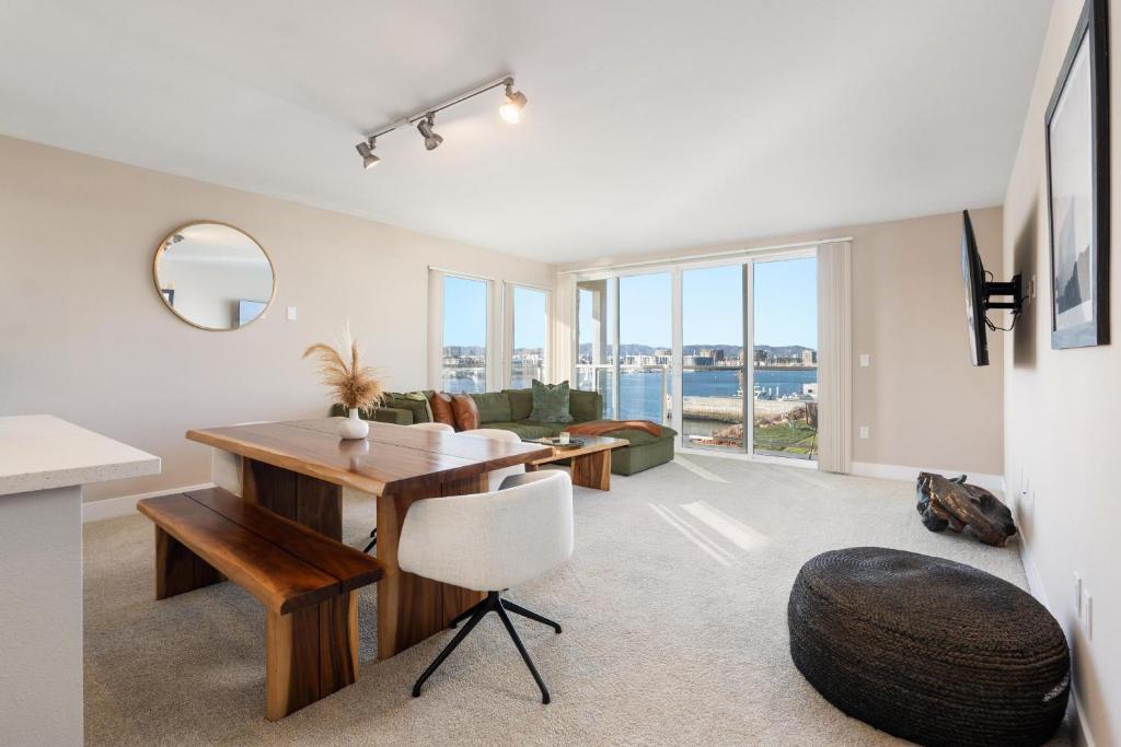 a living room with a table and a couch at Charming Bliss By the Ocean LUXE 2bd 2ba MDR in Los Angeles