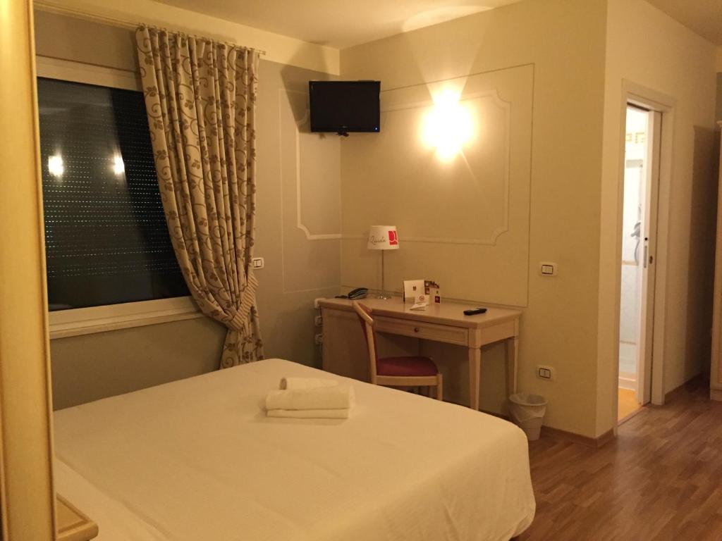 Postel nebo postele na pokoji v ubytování Albergo La Quiete