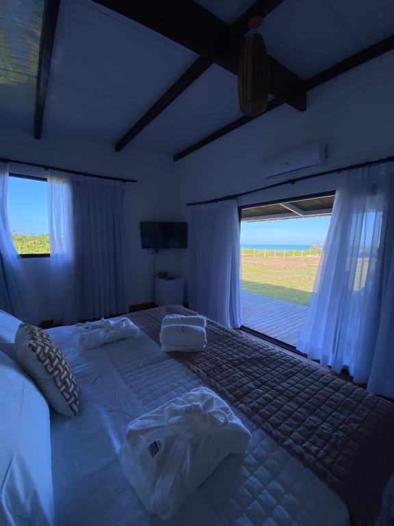 Postel nebo postele na pokoji v ubytování Aponem Spa & Pousada