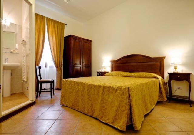 Postel nebo postele na pokoji v ubytování Hotel Il Cavallo