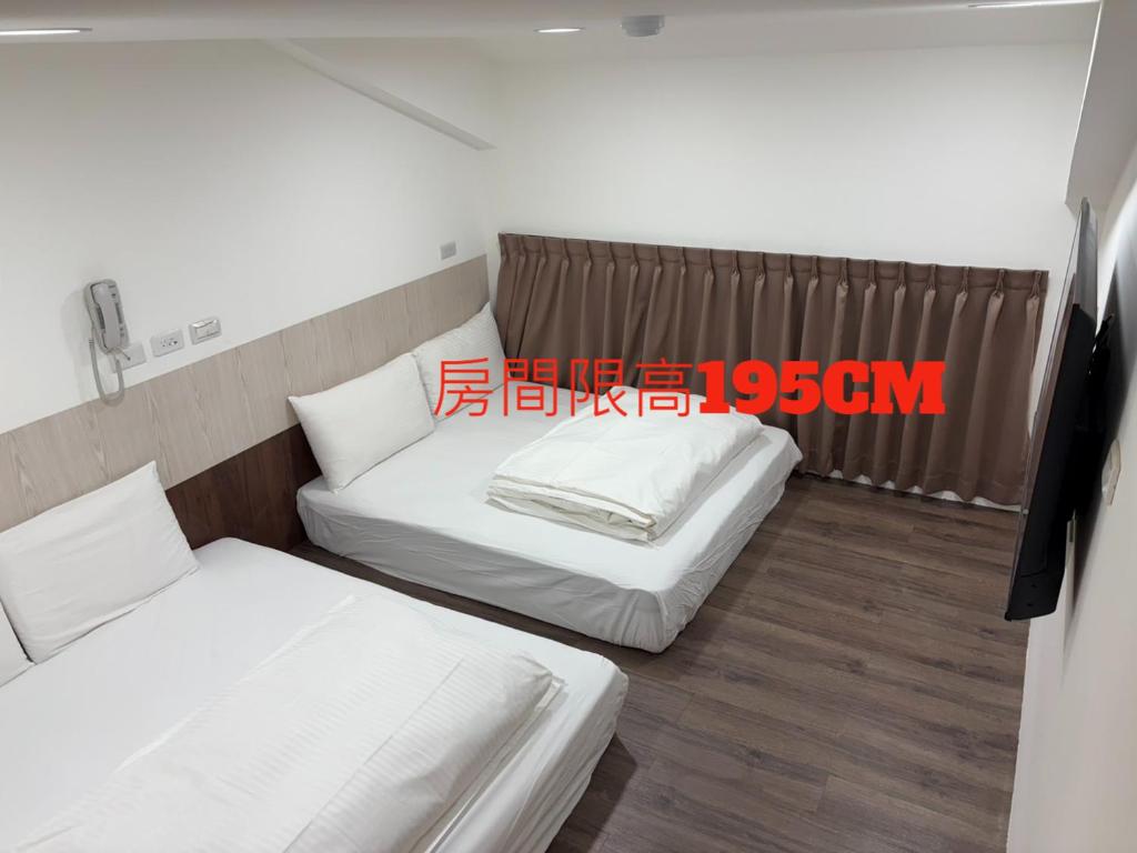 Postel nebo postele na pokoji v ubytování 安平商旅Choona Hotel Anping