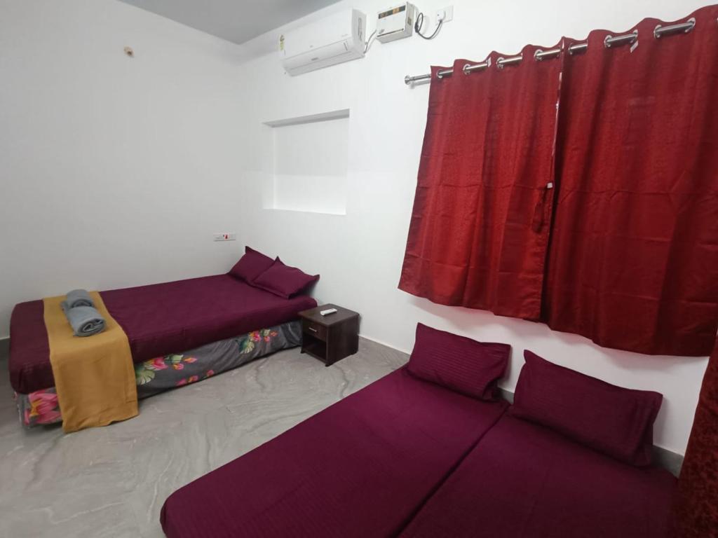 Voodi või voodid majutusasutuse Omkara - The Fives Guest house toas