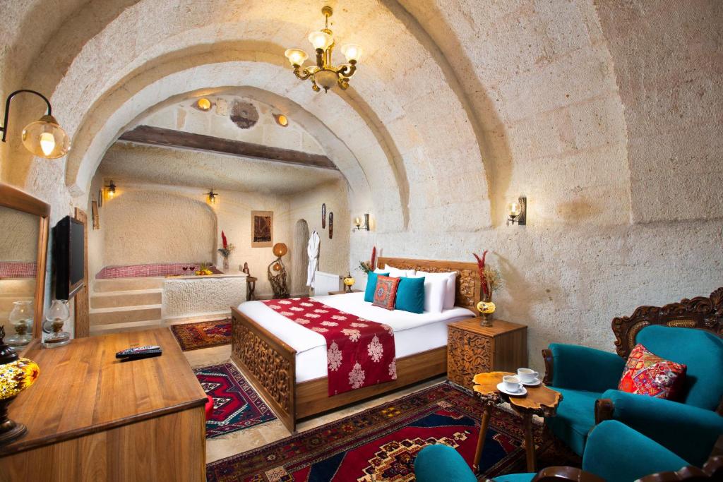 Postel nebo postele na pokoji v ubytování Garden Inn Cappadocia