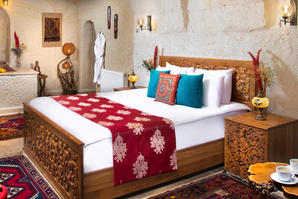 Postel nebo postele na pokoji v ubytování Garden Inn Cappadocia
