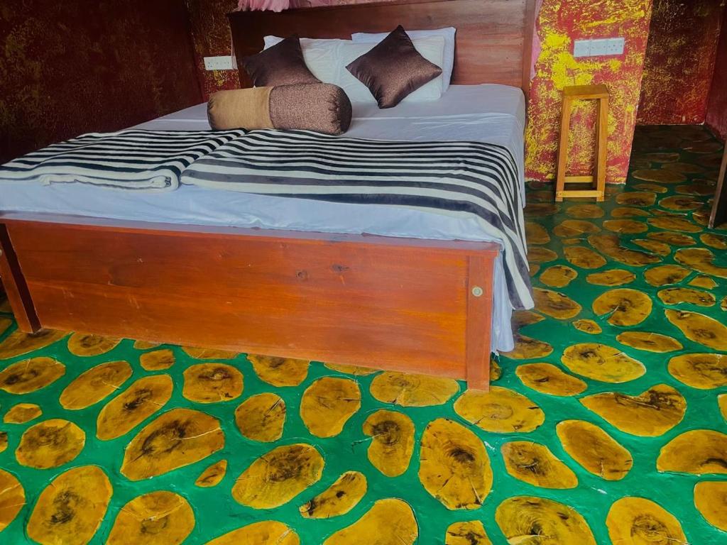 Postel nebo postele na pokoji v ubytování Nine Arch Jungle Inn