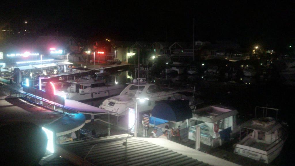 a group of boats docked in a harbor at night at Joli Studio Vue Sur Mer in Pointe-à-Pitre