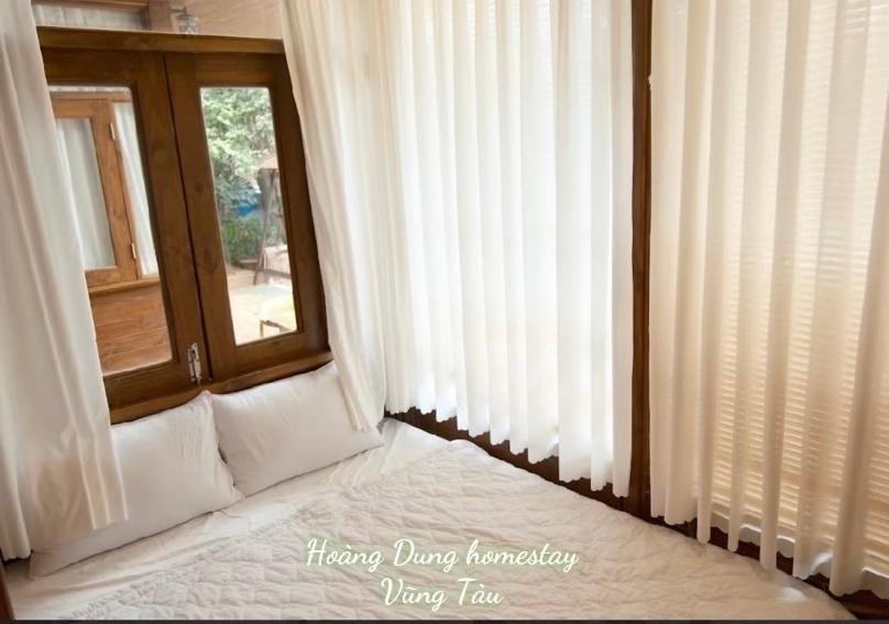 Postel nebo postele na pokoji v ubytování Hoàng Dung homestay- Vũng Tàu