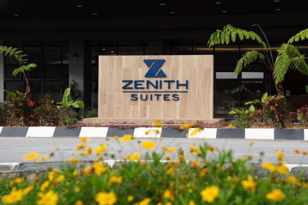 ein zentil studios signiert vor einem Gebäude in der Unterkunft Zenith Suites Cameron in Tanah Rata