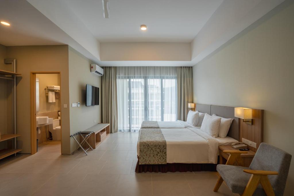 Ein Bett oder Betten in einem Zimmer der Unterkunft Zenith Suites Cameron