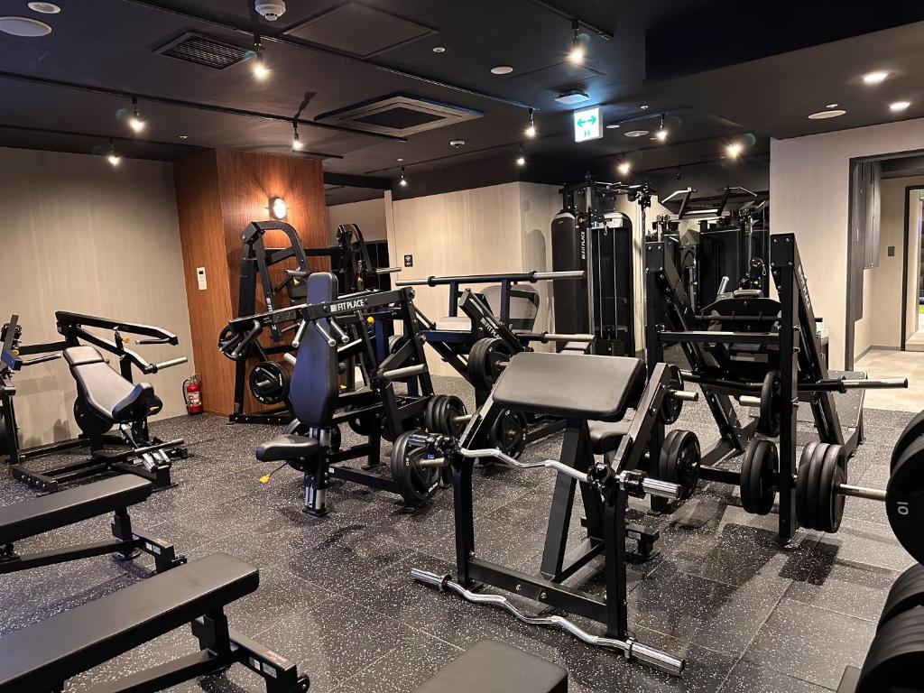 a gym with lots of treadmills and weights at the b ikebukuro in Tokyo