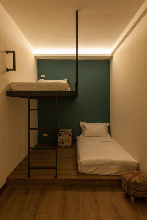 Postel nebo postele na pokoji v ubytování Mini Voyage Hostel
