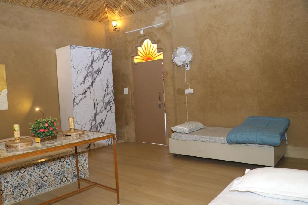 Postel nebo postele na pokoji v ubytování Sai Veda Wellness By Atya Hotels