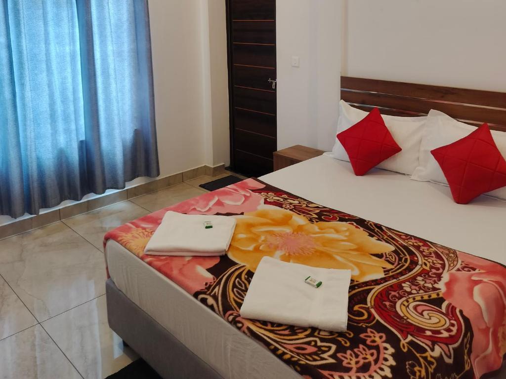 Postel nebo postele na pokoji v ubytování Asprin Homestay