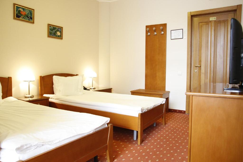 Postel nebo postele na pokoji v ubytování Hotel Hermes