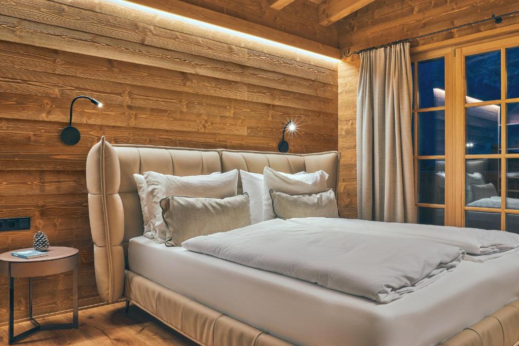 Voodi või voodid majutusasutuse Sissi´s green Chalets toas