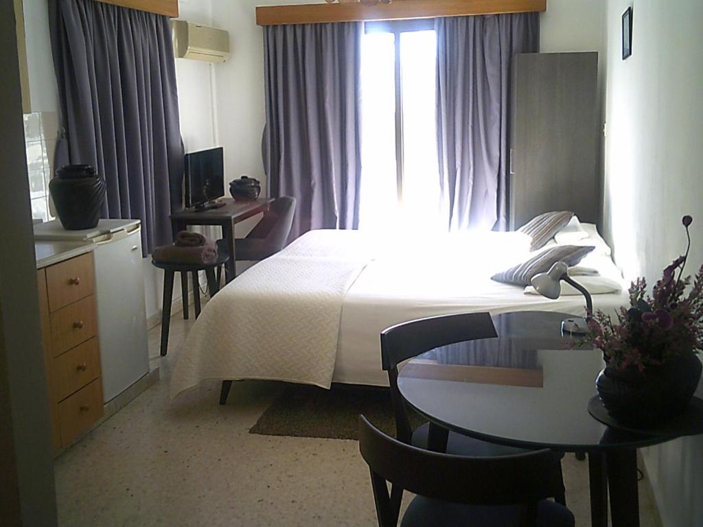 Postel nebo postele na pokoji v ubytování Panklitos Tourist Apartments