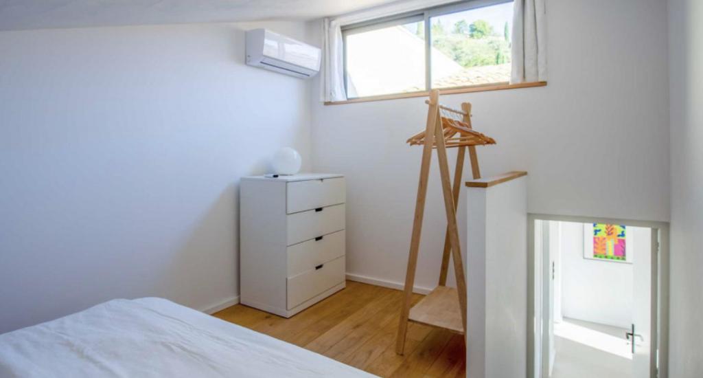 Postel nebo postele na pokoji v ubytování l'Atelier des Milles Roches