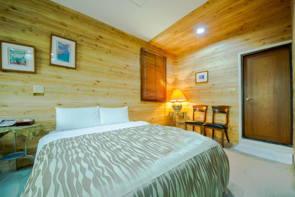 Postel nebo postele na pokoji v ubytování Songyuan B&B