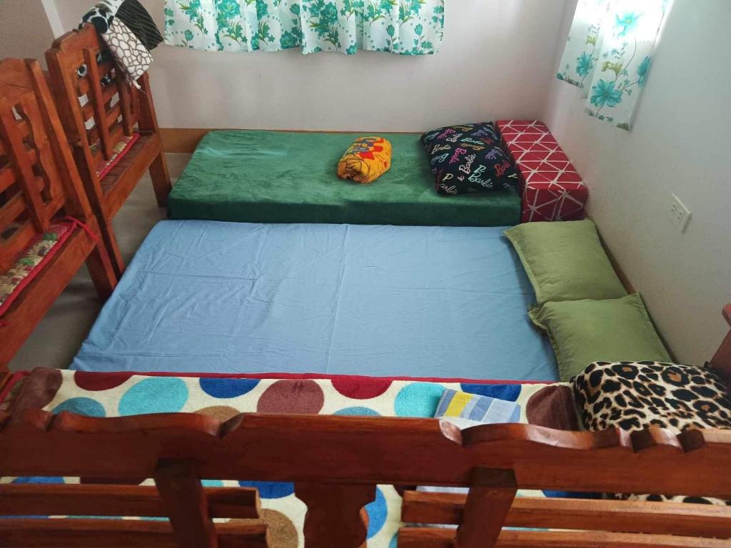 Postel nebo postele na pokoji v ubytování Room in BB - Aremen Transient, Nipa Hut