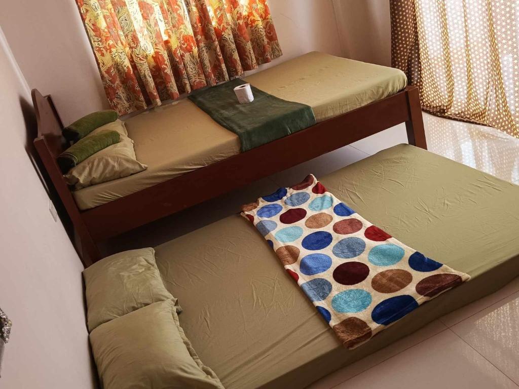 Postel nebo postele na pokoji v ubytování Room in BB - Aremen Transient, Nipa Hut