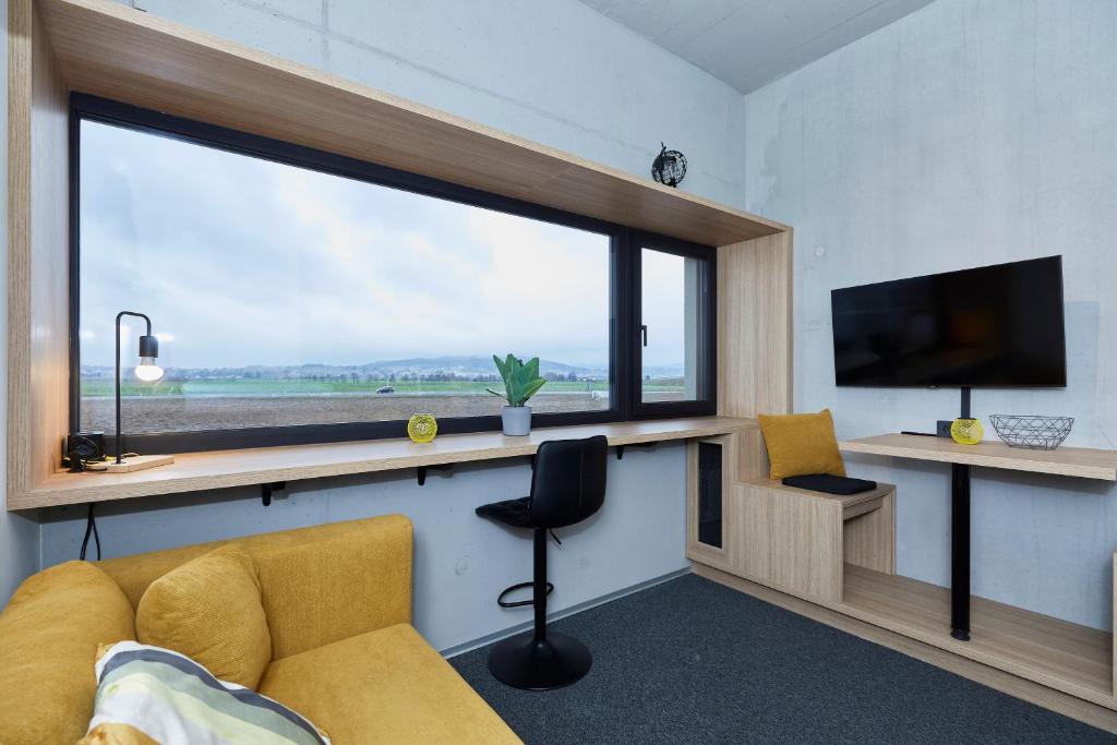TV a/nebo společenská místnost v ubytování miniLOFT apartments Leonding 24 hours