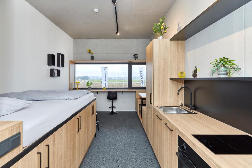 Kuchyň nebo kuchyňský kout v ubytování miniLOFT apartments Leonding 24 hours