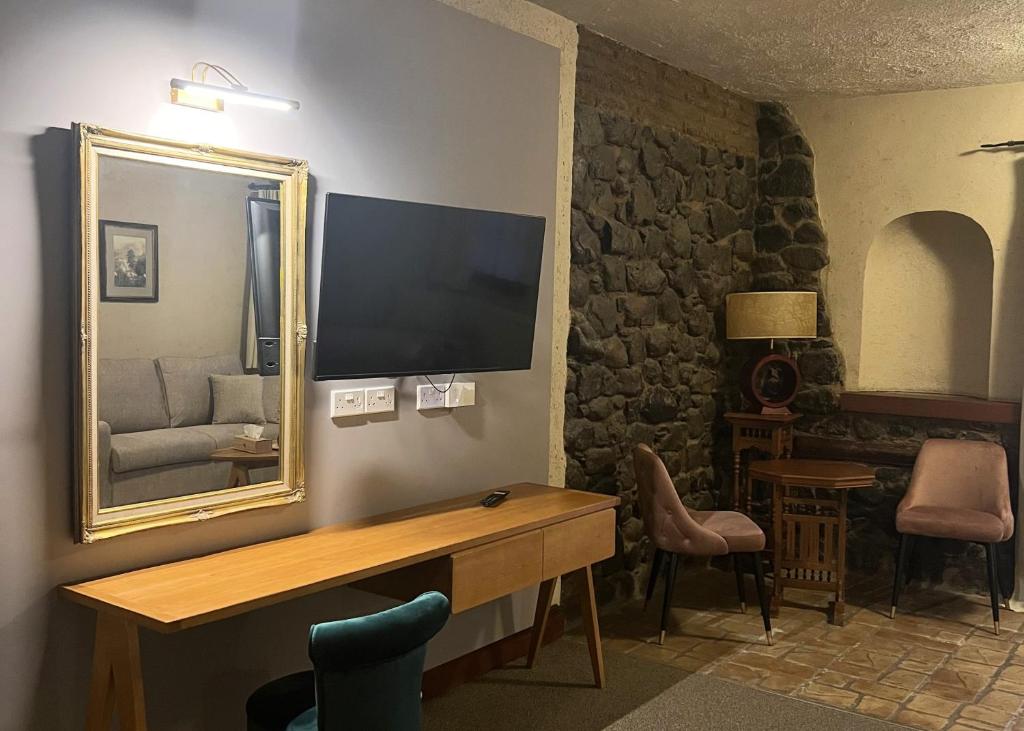 TV a/nebo společenská místnost v ubytování The Mill Hotel