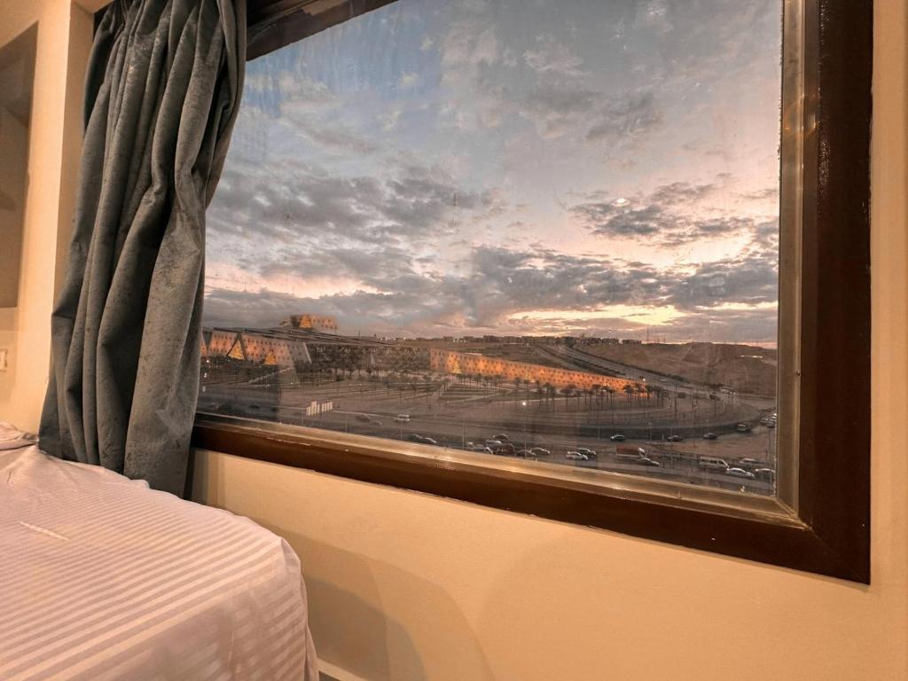 Postel nebo postele na pokoji v ubytování Grand Museum View Inn