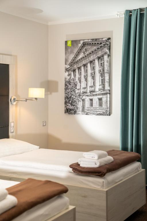 Postel nebo postele na pokoji v ubytování Hotel Grunt