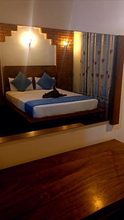 Postel nebo postele na pokoji v ubytování Peacock Eco Resort Sigiriya