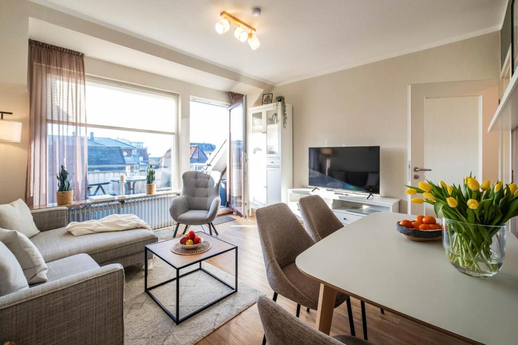 TV a/nebo společenská místnost v ubytování Haus Am Anker Wohnung 7