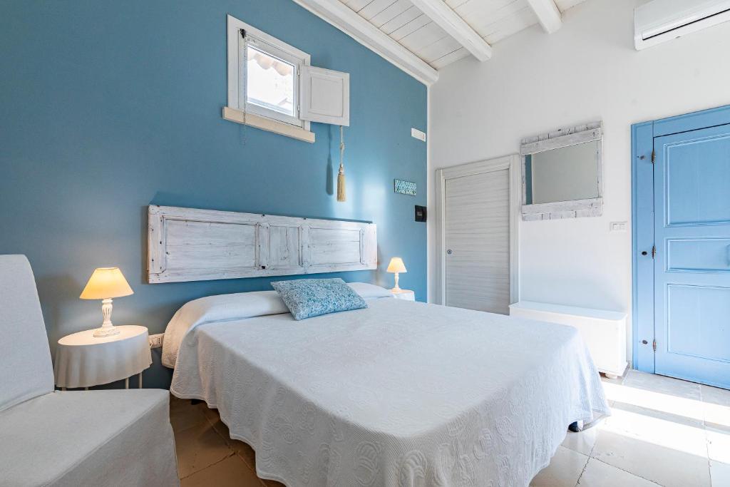 Postel nebo postele na pokoji v ubytování Masseria La Tofala benessere & SPA