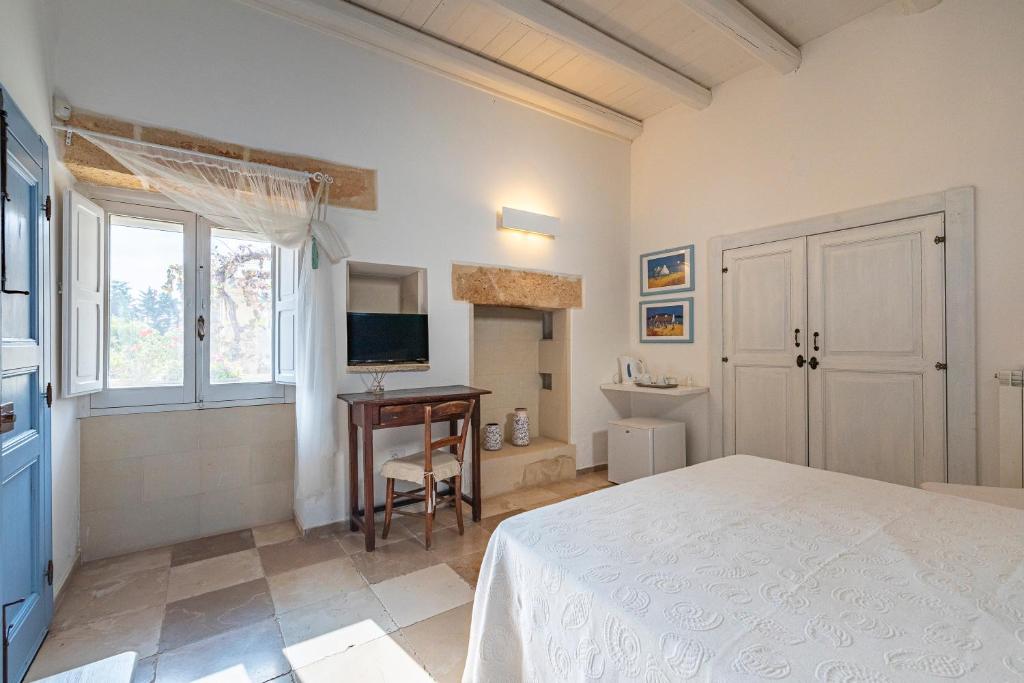 TV a/nebo společenská místnost v ubytování Masseria La Tofala benessere & SPA