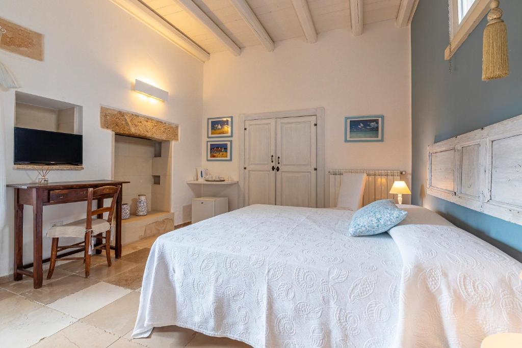 Postel nebo postele na pokoji v ubytování Masseria La Tofala benessere & SPA