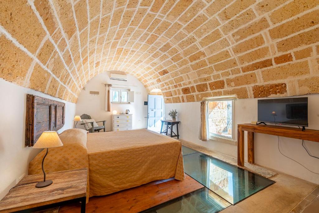 TV a/nebo společenská místnost v ubytování Masseria La Tofala benessere & SPA