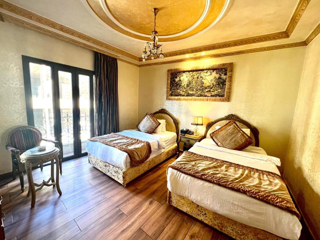 Postel nebo postele na pokoji v ubytování Q Hotel