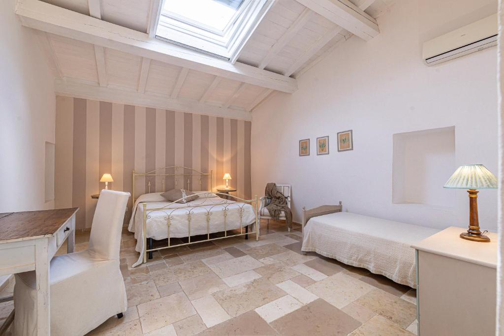 Postel nebo postele na pokoji v ubytování Masseria La Tofala benessere & SPA