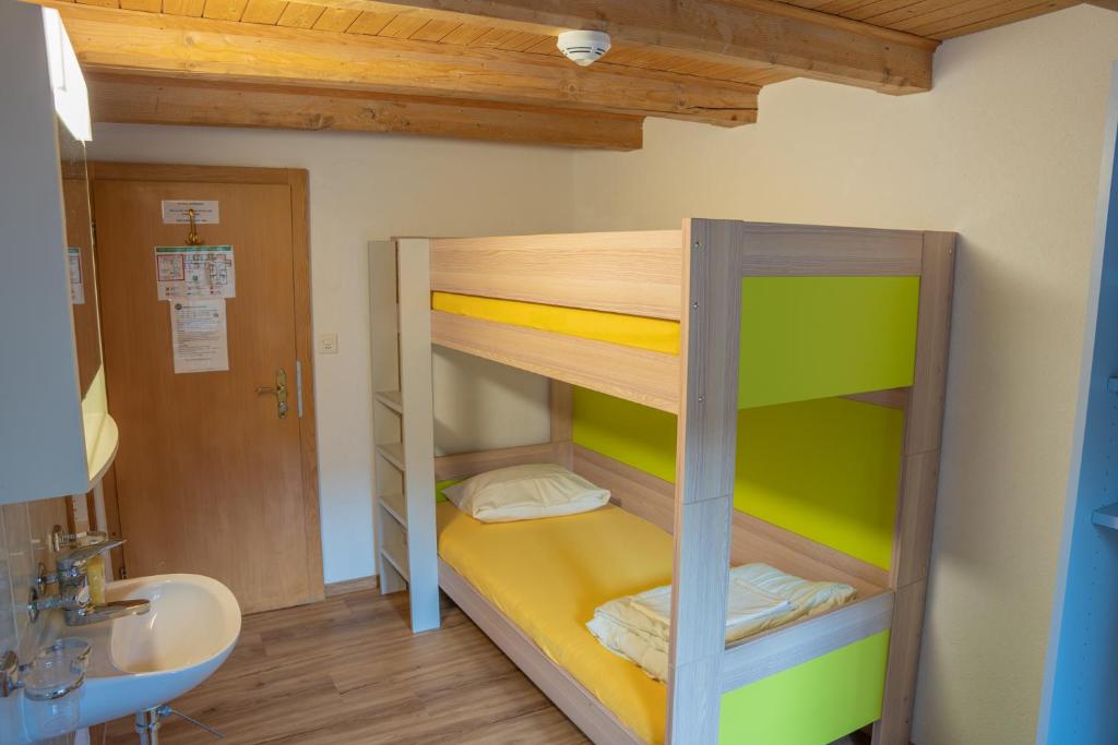 Postel nebo postele na pokoji v ubytování juhui Flumserberg