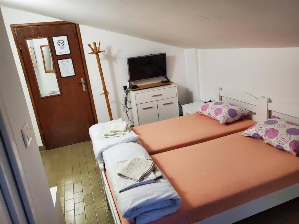 Postel nebo postele na pokoji v ubytování Guest House Olga