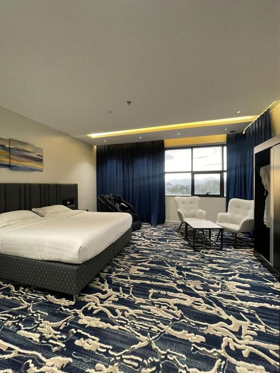 Postel nebo postele na pokoji v ubytování فندق قمم بارك Qimam Park Hotel 6