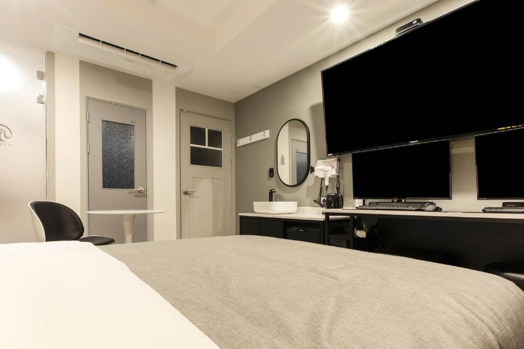 Postel nebo postele na pokoji v ubytování Arentz Hotel
