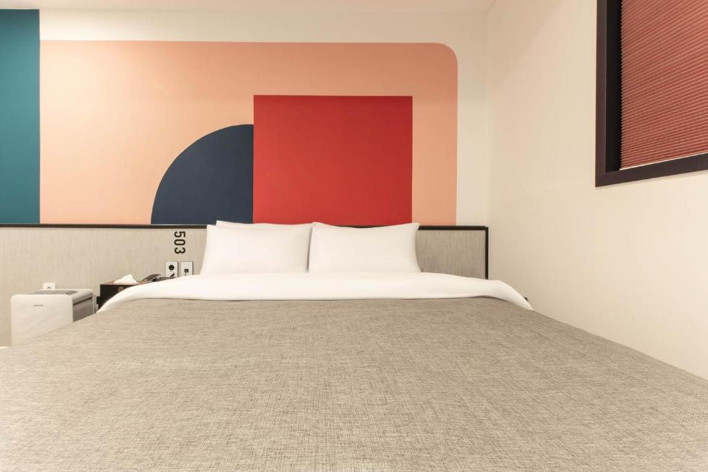 Postel nebo postele na pokoji v ubytování Arentz Hotel
