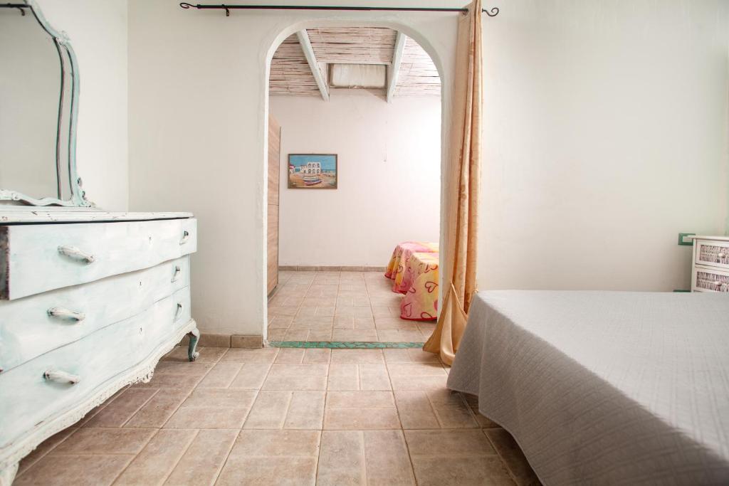 Postel nebo postele na pokoji v ubytování Locanda Domus De Vida